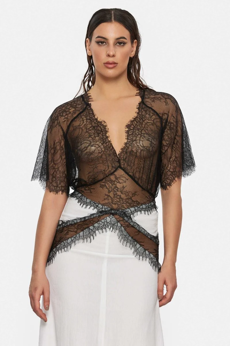 Dress made out of white linen and black lace. See through. Bell sleeves. Geometric cuts.