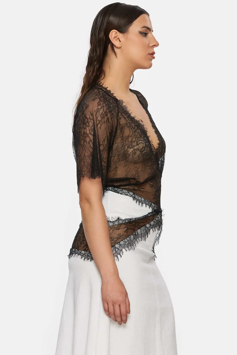 Dress made out of white linen and black lace. See through. Bell sleeves. Geometric cuts.