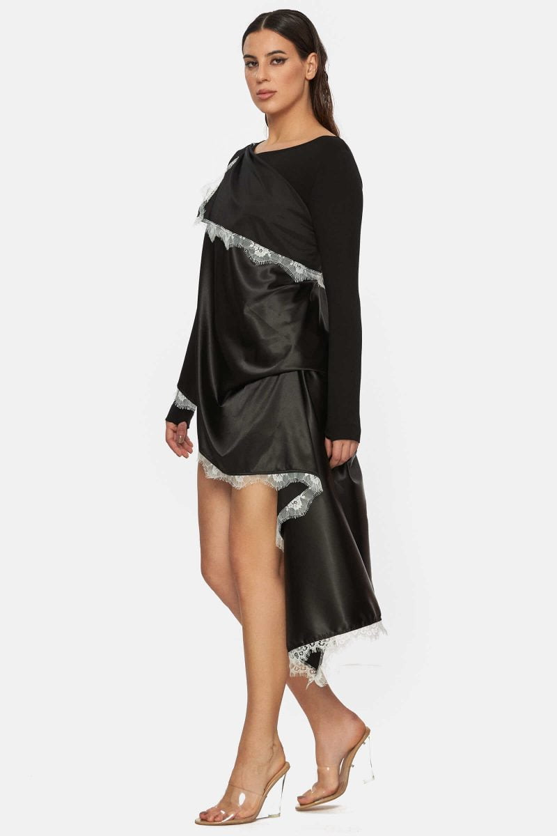 Fitted black cotton mini dress with an applied satin scarf around the body. The sleeves have holes for the big thumb.