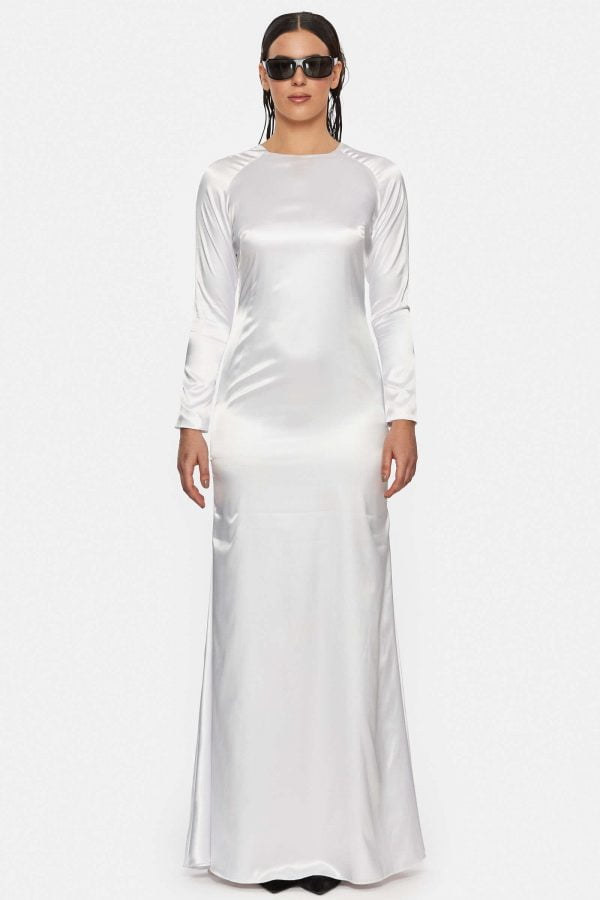 Long white dress with raglan sleeves and cut out back. Back hidden zipper. Made out of satin.