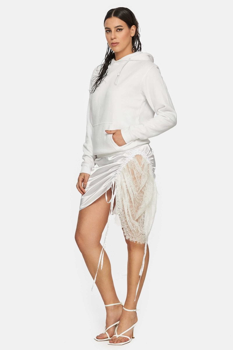 Hybrid hoodie dress with an asymetric intervention of white lace. Adjustable cords for the skirt. A mix of a cotton hoodie and satin skirt.