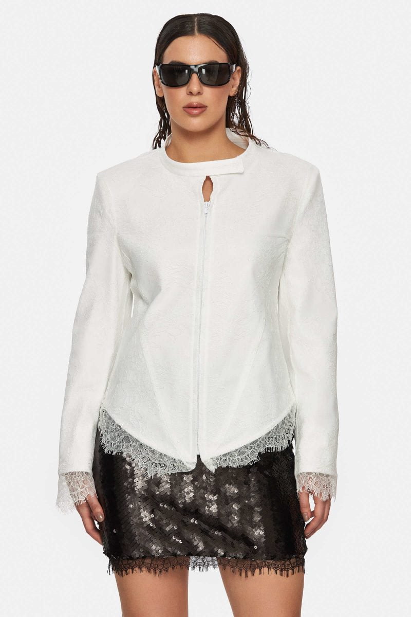 White denim jacket with an white lace overlay. Front zipper. No pockets. No  lining.