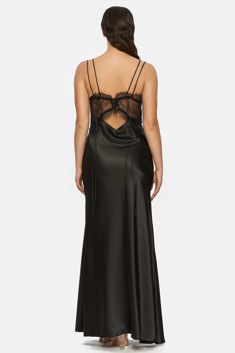 Slipdress made out of black satin with a front cut-out. Two spaghetti straps that are adjustable at the back. See through lace at the back that closes with 3 buttons.