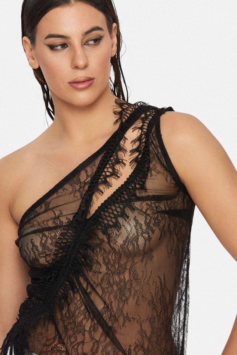 Sheer top with adjustable cords. Cut-outs on front and back.